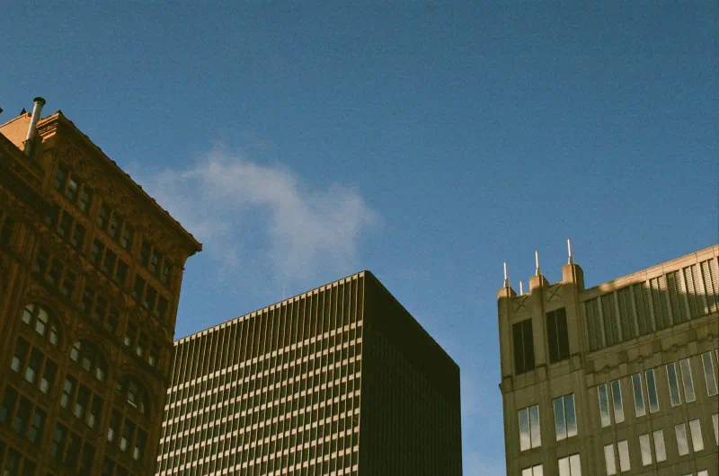Brick and stone buildings against a blue sky